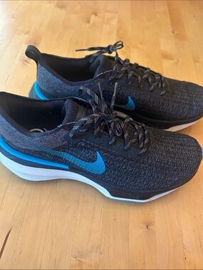 Nike Men’s Black Athletic Shoes with Blue Swoosh Zoom X